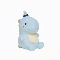 Morbido peluche a forma di dinosauro seduto colore celeste con corno multicolore