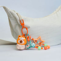 Portachiavi capibara con cappuccio da animaletto kawaii disponibile in 4 varianti: capibara apetta, capibara panda, capibara rana, capibara volpina.