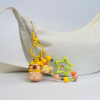 Portachiavi capibara con cappuccio da animaletto kawaii disponibile in 4 varianti: capibara apetta, capibara panda, capibara rana, capibara volpina.