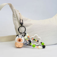 Portachiavi capibara con cappuccio da animaletto kawaii disponibile in 4 varianti: capibara apetta, capibara panda, capibara rana, capibara volpina.