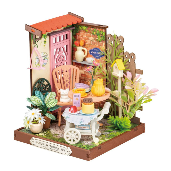 Puzzle in 3d che riproduce in miniatura una scena di un tea all'aperto.