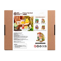 Puzzle in 3d che riproduce in miniatura una scena di un tea all'aperto.