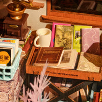 Puzzle in 3d che riproduce in miniatura l'angolo di una libreria dal sapore vintage