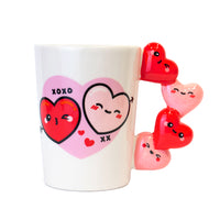 Tazza San Valentino con manico a cuoricini.
