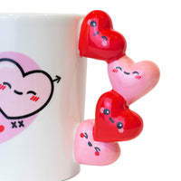 Tazza San Valentino con manico a cuoricini.