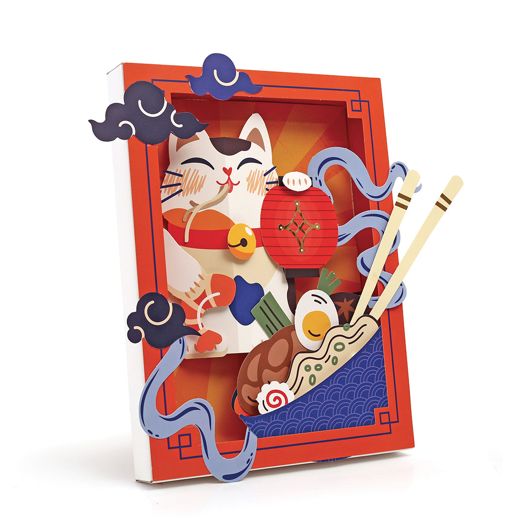 Kit con tutto l'occorrente per realizzare una decorazione in carta a tema ramen.