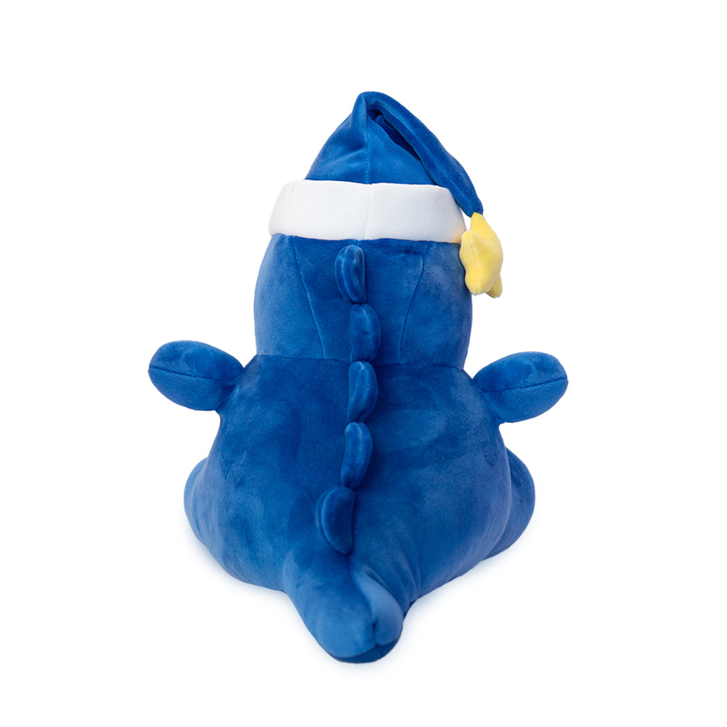 Peluche di un dinosauro in versione nanna.