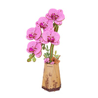 Puzzle in 3d che riproduce un'orchidea rosa.