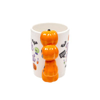 Tazza di Halloween con manico a forma di zucche.